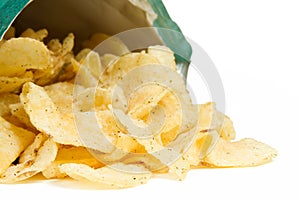 Potato Chips Spilling from Bag on White Background
