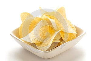 Potato chips in a white bowl