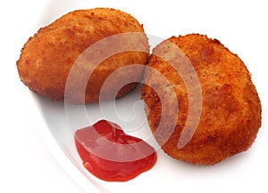 Potato chops with tomato ketchup
