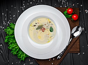 Potato cream soup with bacon and cheese