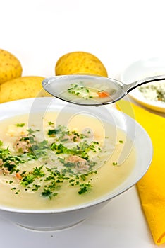 Potato cream soup with chopped meat balls