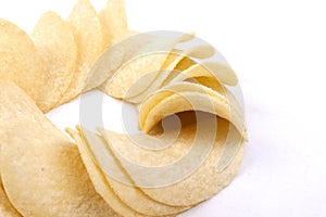 Potato crisps (chips) on a white background