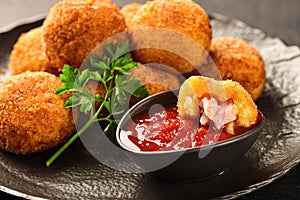 POTATO CROQUETTES with ham and sauce close-up