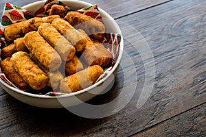 Potato croquettes & x28;croquetas& x29; on wooden surface. photo