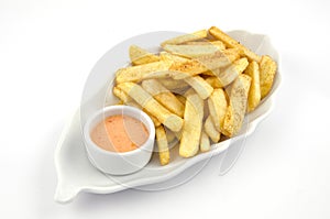 Potato fries and sauce on the plate on the white background