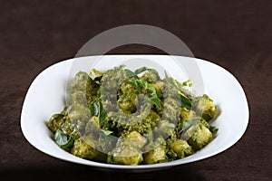 Potato Gnocchi with Basil Pesto and Grated Parmesan Cheese deliciuns rondelli and cannelloni pasta in white sauce with parmesan