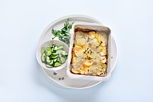 Potato gratin in baking dish