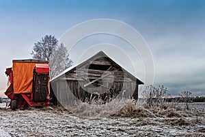 Potato Harvester By An Old Barn