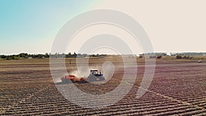 potato harvesting. potato harvester. Farm machinery, tractor with potato harvester, are harvesting potatoes, on a farm