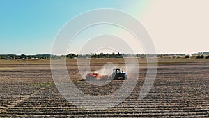 potato harvesting. potato harvester. Farm machinery, tractor with potato harvester, are harvesting potatoes, on a farm