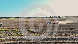 potato harvesting. potato harvester. Farm machinery, tractor with potato harvester, are harvesting potatoes, on a farm