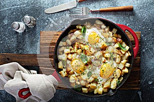 Potato hash with ham and eggs