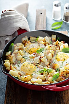 Potato hash with ham and eggs