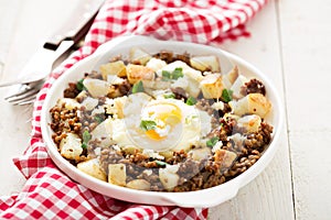 Potato hash with sausage and fried egg