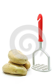 Potato with masher photo