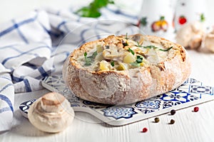 Potato-mushroom soup in a loaf of bread