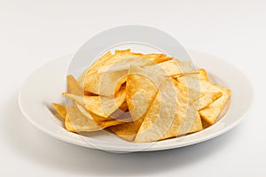 Potato nachos on a white plate