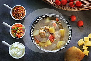 Potato onion and chicken soup with ingredients