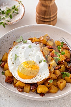 Potato, onion and ham hash topped with fried egg