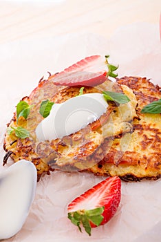 Potato pancakes with apfel and strawberry photo