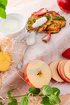 Potato pancakes with apfel and strawberry photo