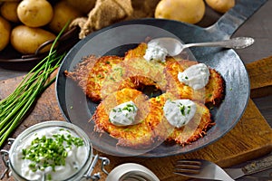 Potato pancakes with curd and chives photo