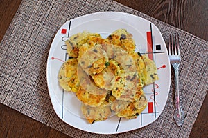 Potato pancakes with green onions. Draniki - potato fritters. The naitonal dish of Belarus, Ukraine and Russia. Potato zucchini