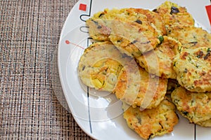 Potato pancakes with green onions. Draniki - potato fritters. The naitonal dish of Belarus, Ukraine and Russia. Potato zucchini