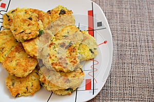 Potato pancakes with green onions. Draniki - potato fritters. The naitonal dish of Belarus, Ukraine and Russia. Potato zucchini