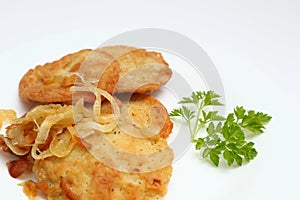 Potato pancakes or latkes or draniki on white plate. Top view. Copy space. Fried potato pancakes