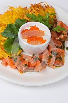 Potato pancakes salmon fish and red caviar
