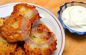 Potato pancakes with sour cream