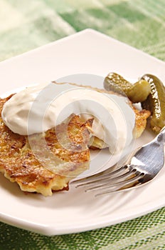 Potato pancakes with sour cream