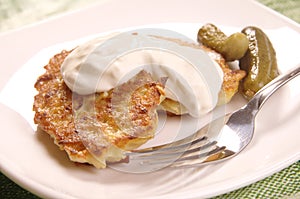 Potato pancakes with sour cream