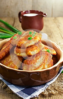 Potato pancakes on a wooden surface