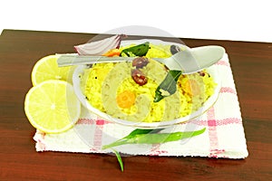 Potato Poha or batata pova puffed Beaten Rice Indian breakfast dish photo