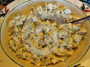 Potato Salad in a Dish with a Spoon
