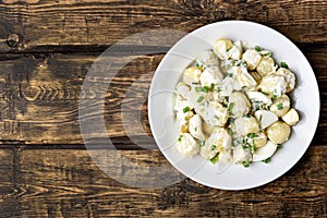 Potato salad with eggs and green onion