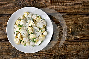 Potato salad with eggs and green onion