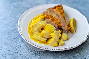 Potato Salad with Mustard, Turmeric and Curry Sauce. Served with Schnitzel