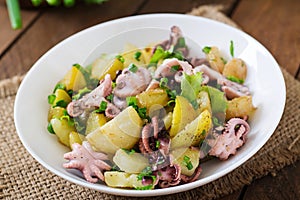 Potato salad with pickled octopus and onions