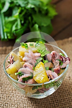 Potato salad with pickled octopus and onions