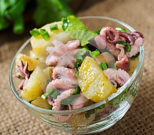 Potato salad with pickled octopus and onions