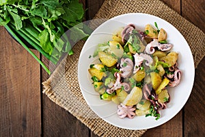 Potato salad with pickled octopus and onions