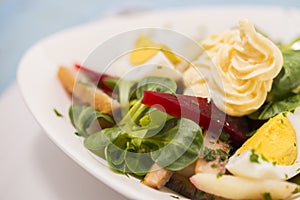 Potato salad with red beet, smoked herring, egg and soy-bean mayonnaise