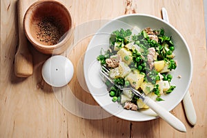 Potato salad with tuna and green peas