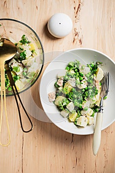 Potato salad with tuna and green peas