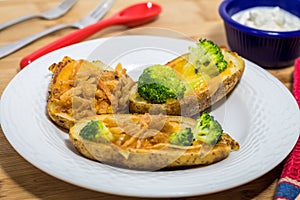 Potato Skins appetizer with broccoli, cheddar cheese and fried onions