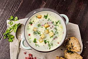 Potato soup with ham and bread