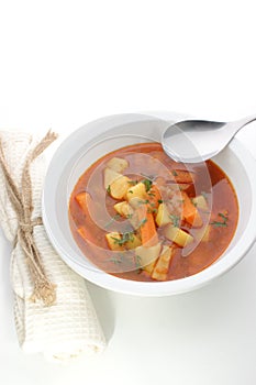 Potato soup in a white bowl